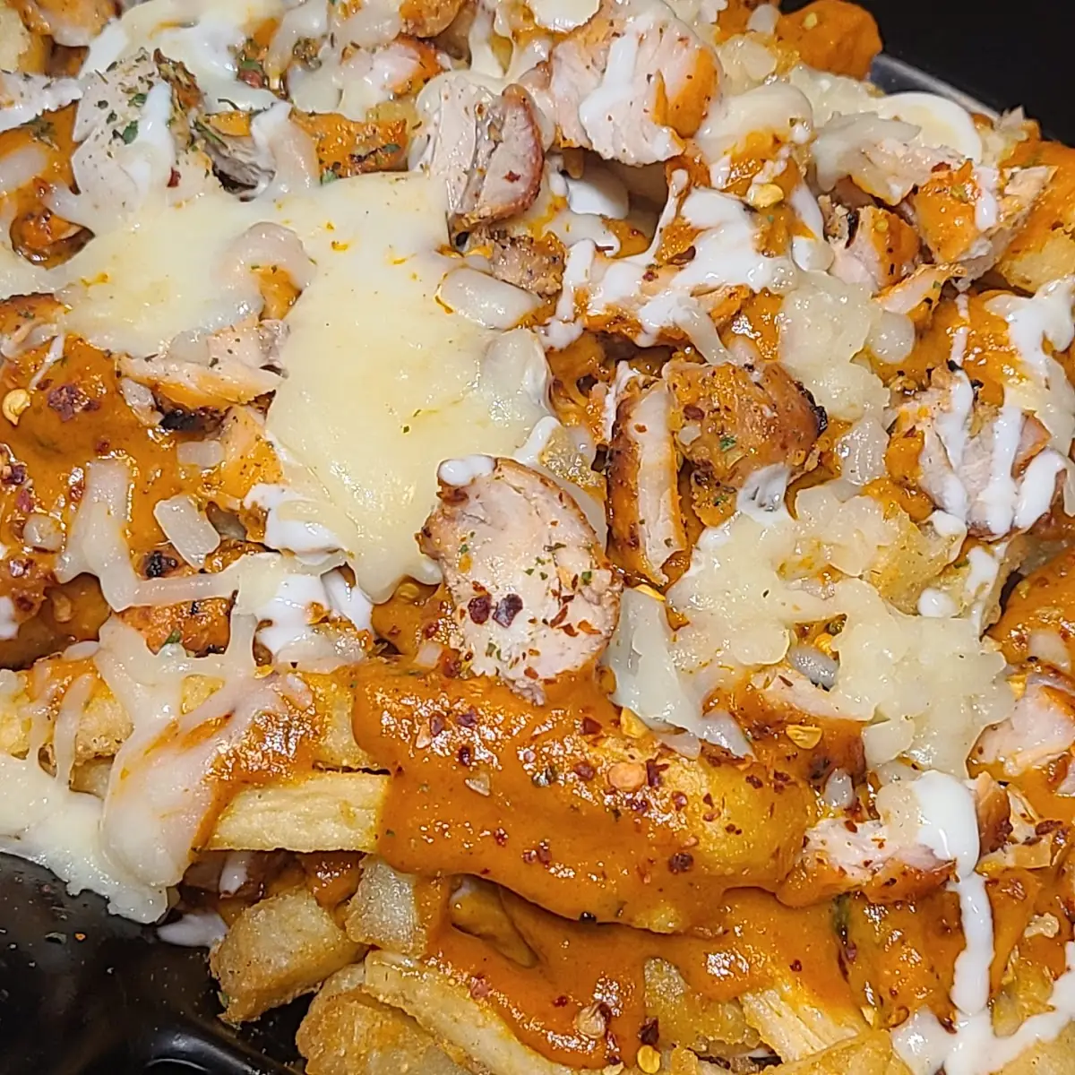 Butter Chicken Poutine, Bollywood Cafe Indian Street Eats & Bar.