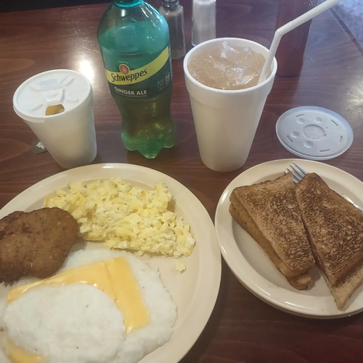 Salmon Cakes Scrambled Eggs with Cheese Grits with Cheese Wheat Toast Butter & Jelly