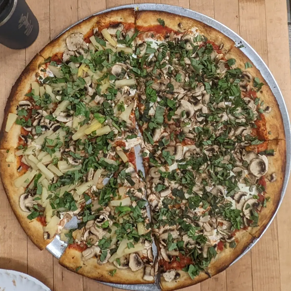 Fresh Mozzarella Cheese One Half Mushroom Basil and Other Half Pineapple Added