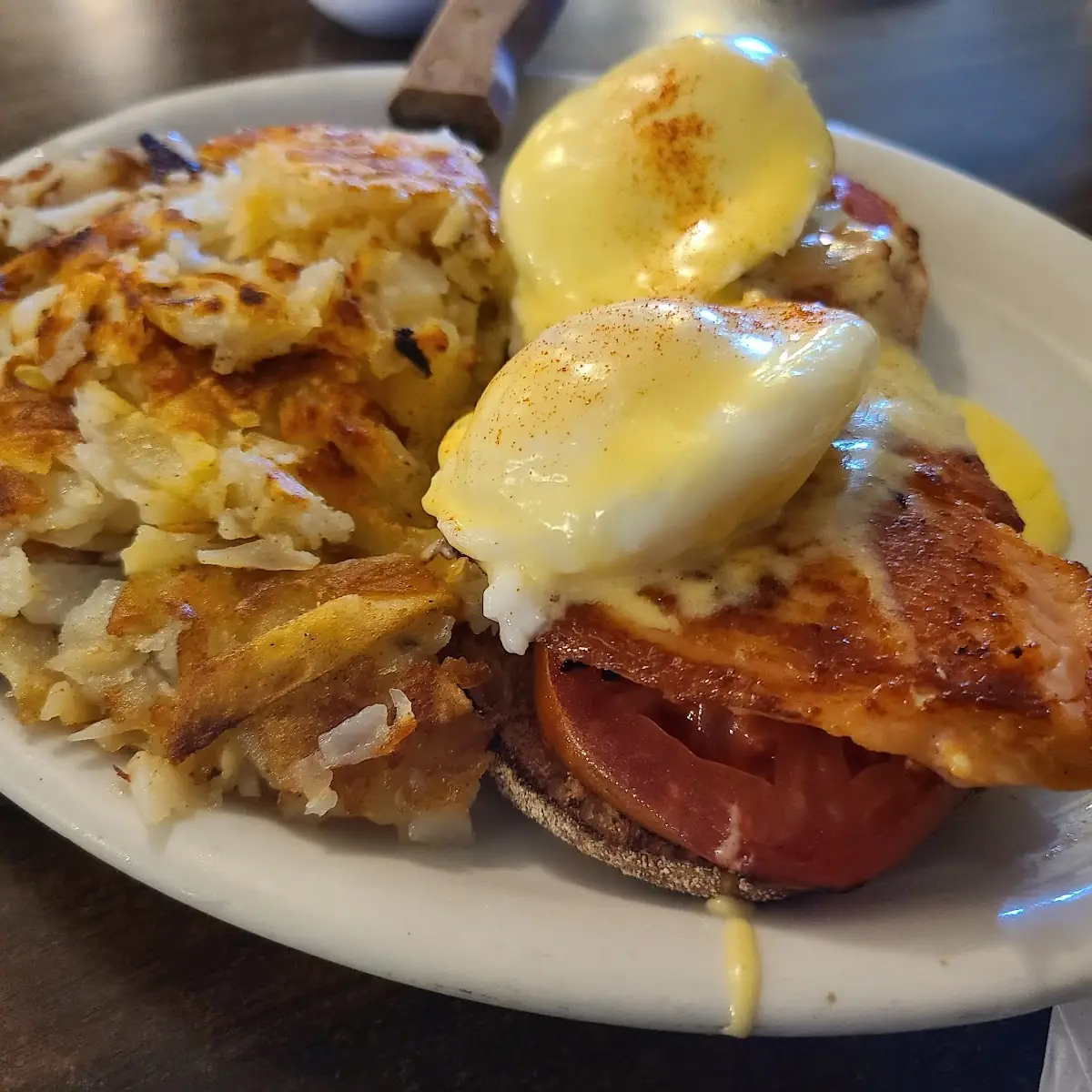 Traditional Eggs Benedict with Cholulu and Cheese-Covered Hash Browns