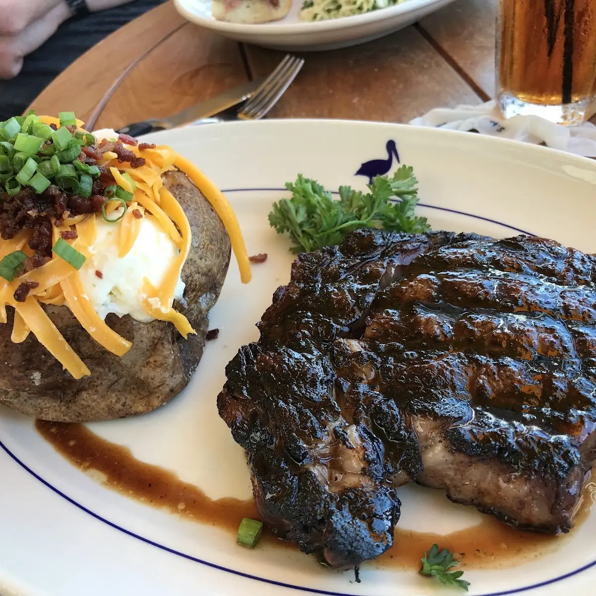 Barbecued Ribs with a Loaded Baked Potato