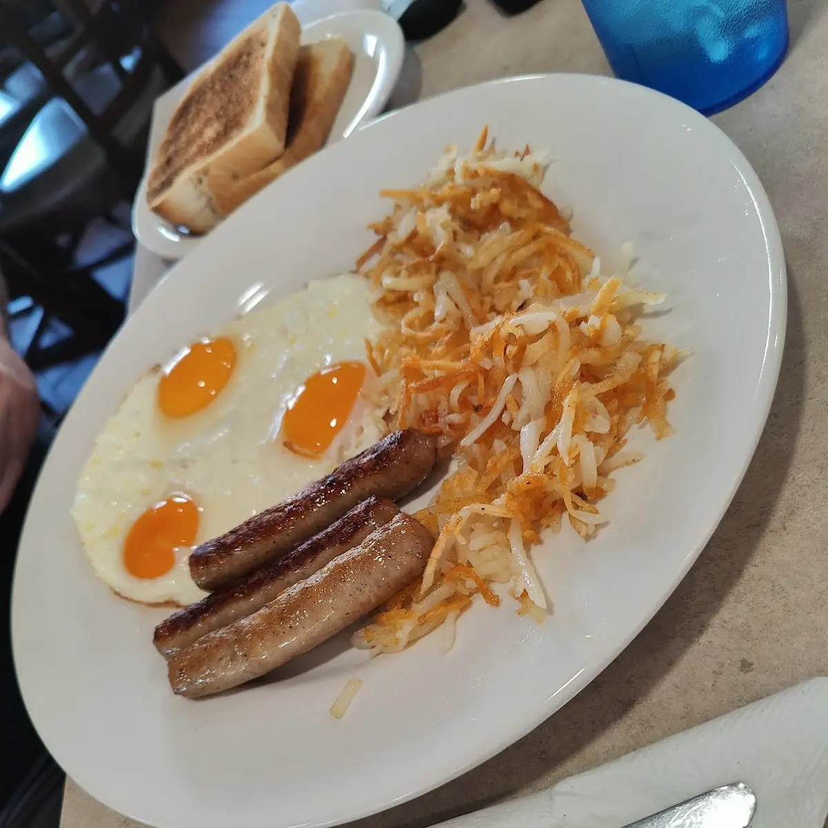 Two Eggs & Hash Browns & Toast or Pancakes