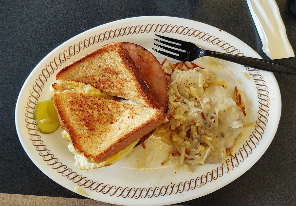 Egg Ham Egg and Cheese Sandwich with Gravy on Hashbrowns