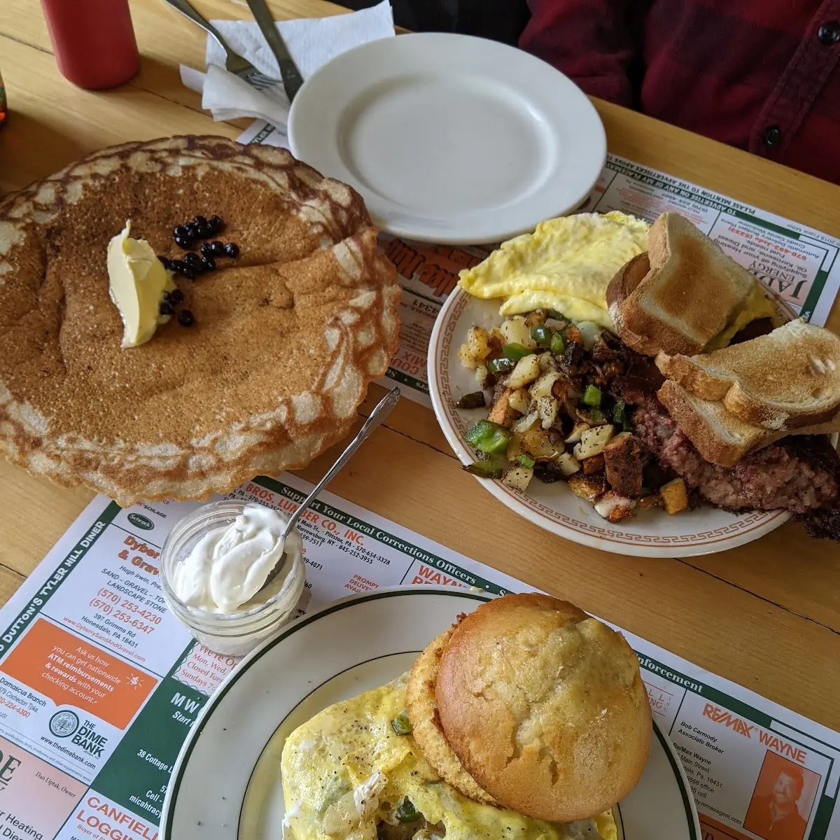 Eggs Scrabbled with Corn Beef Hash Sauteed Peppers and Onions with Home Fries