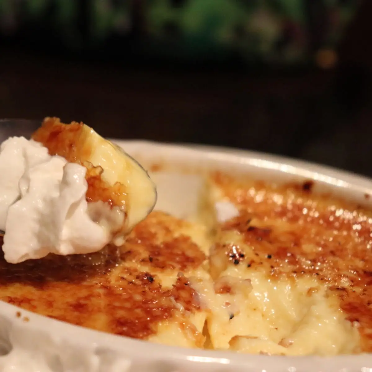Creme Brulee with Whipped Cream and a Cherry