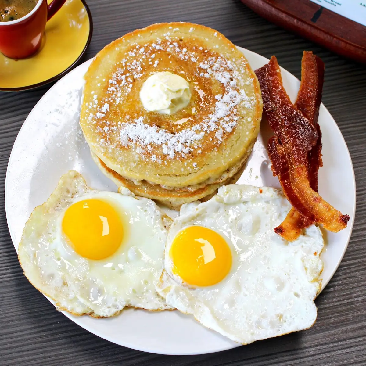 Two Eggs Any Style with Ham or Bacon Cheese & Toast