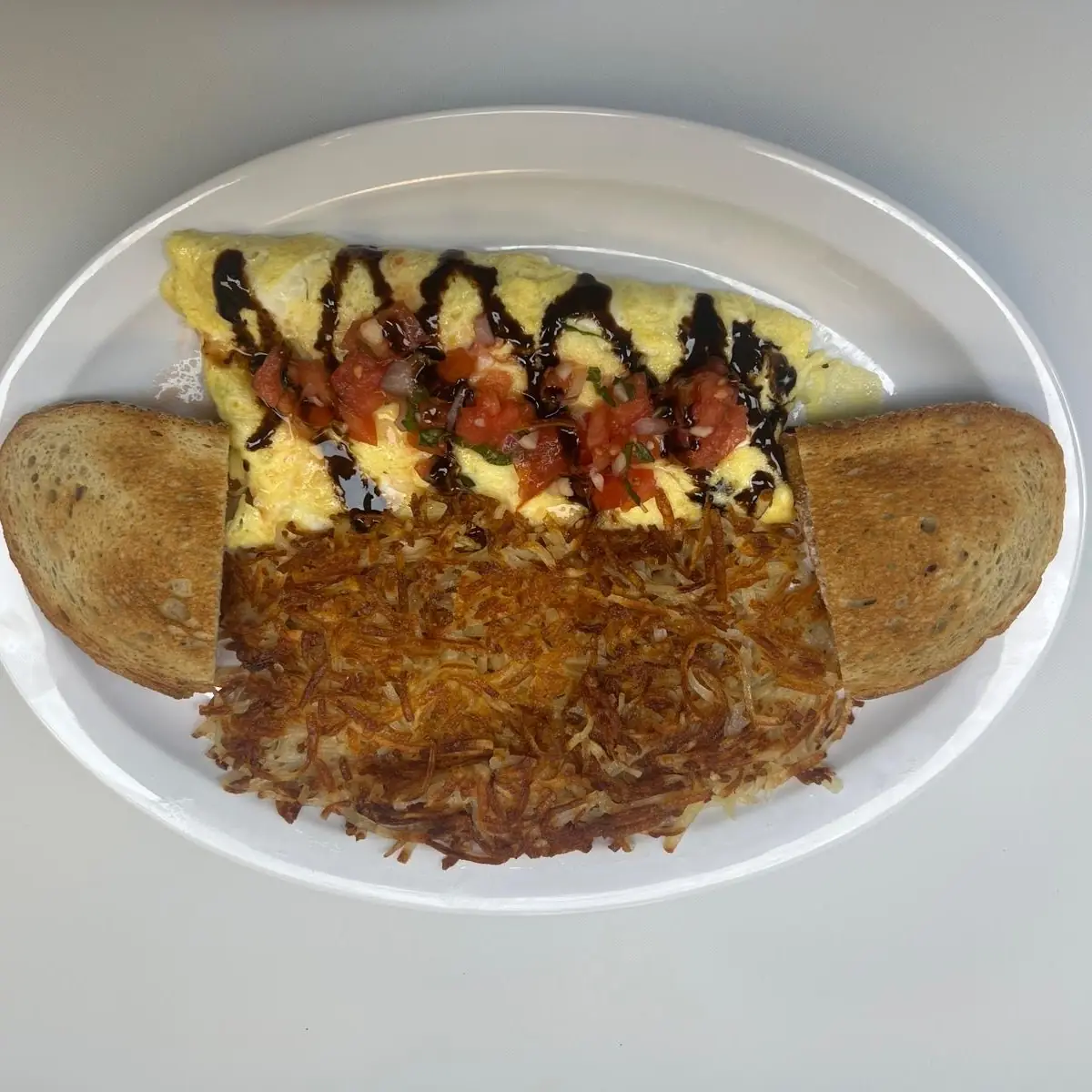Single Scrambled Egg with Home Fries and Toast