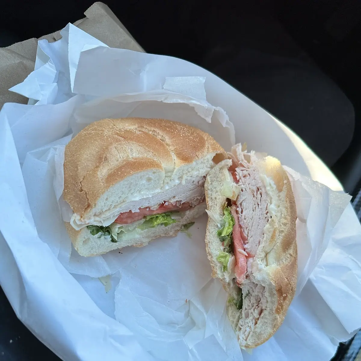 Plain Roll with Turkey Swiss Lettuce Tomato Salt Pepper and Vinegar
