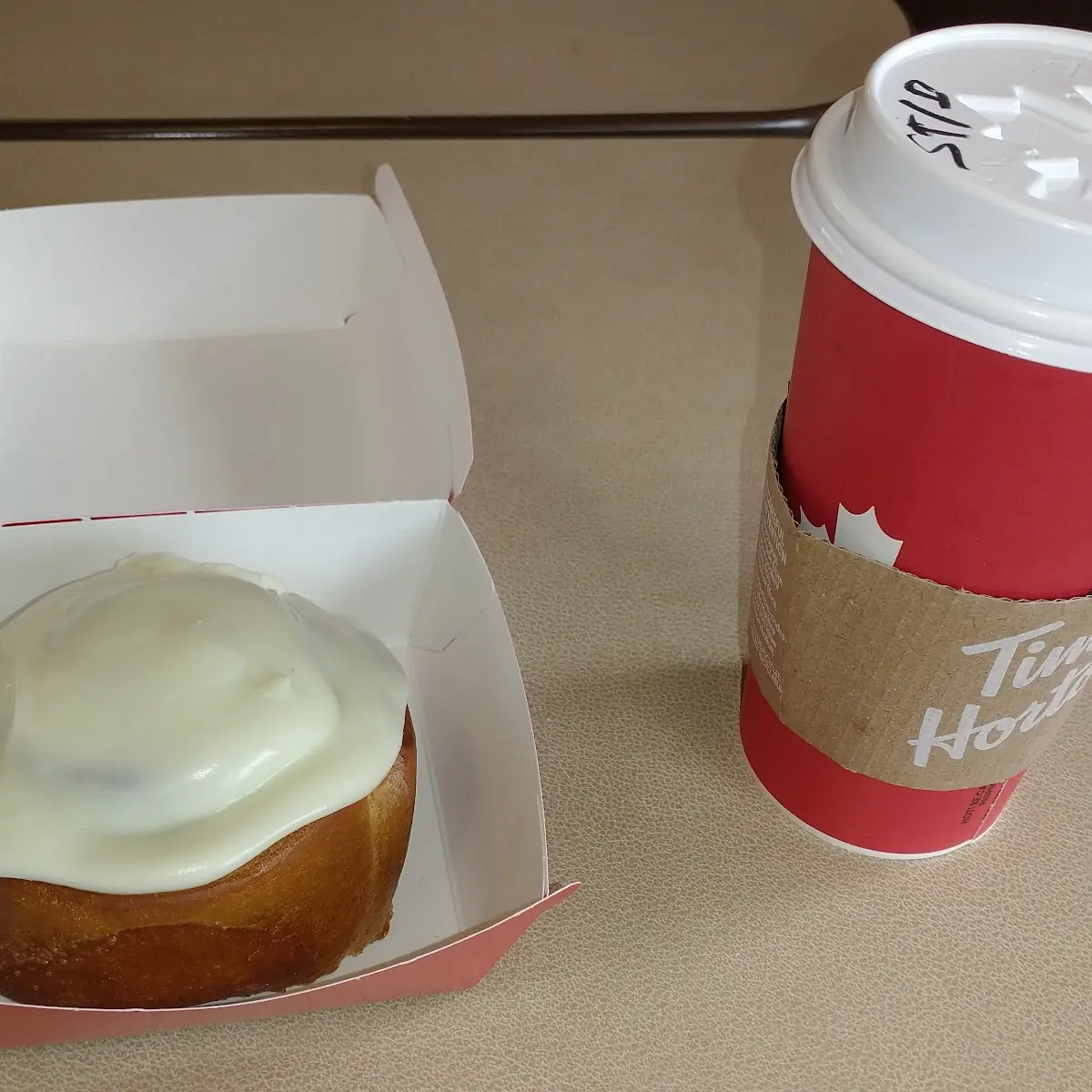 Frosted Cinnamon Bun with Hot Tea, Tim Hortons