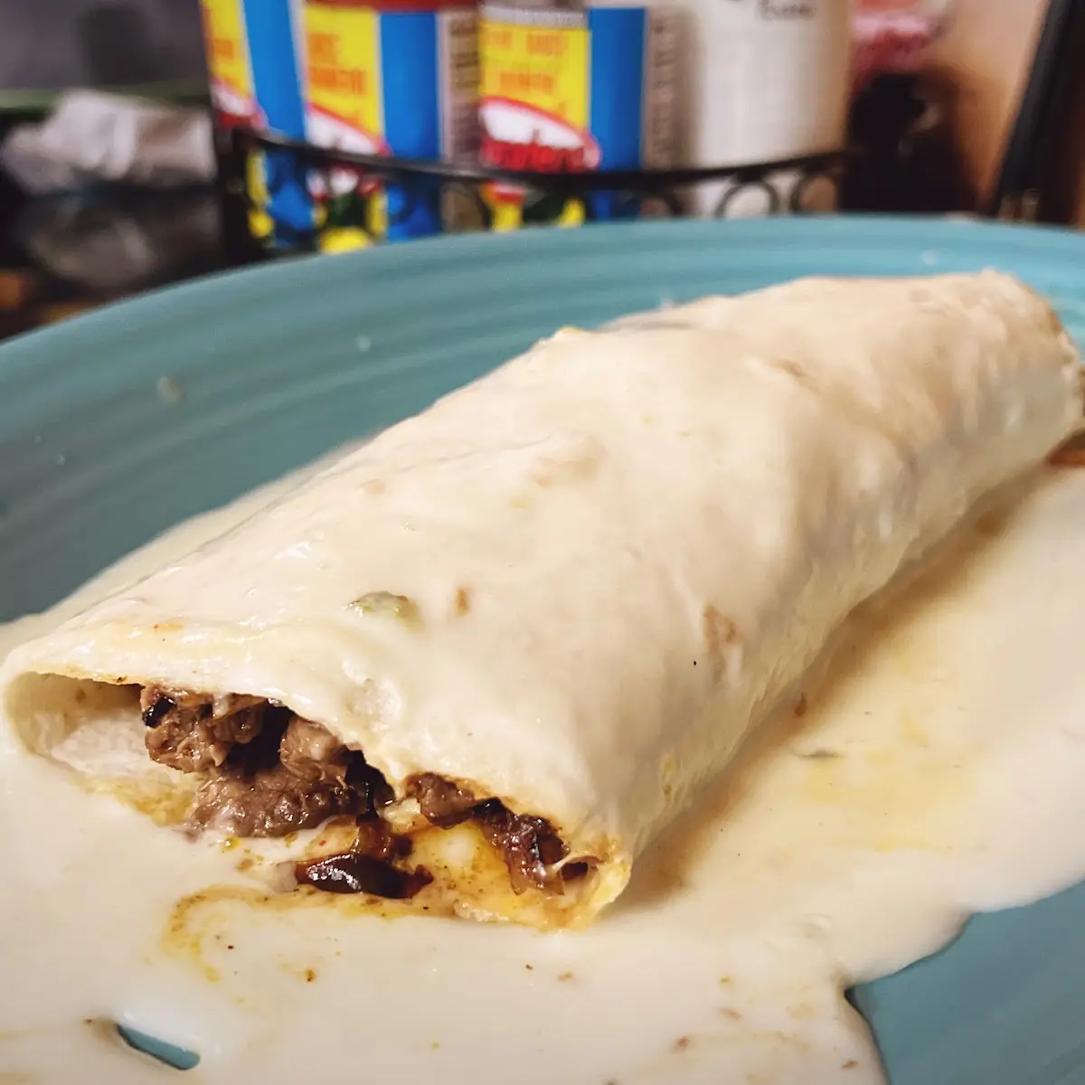 11. 1 Beef Burrito Served with Lettuce, Tomato, Sour Cream, and Rice