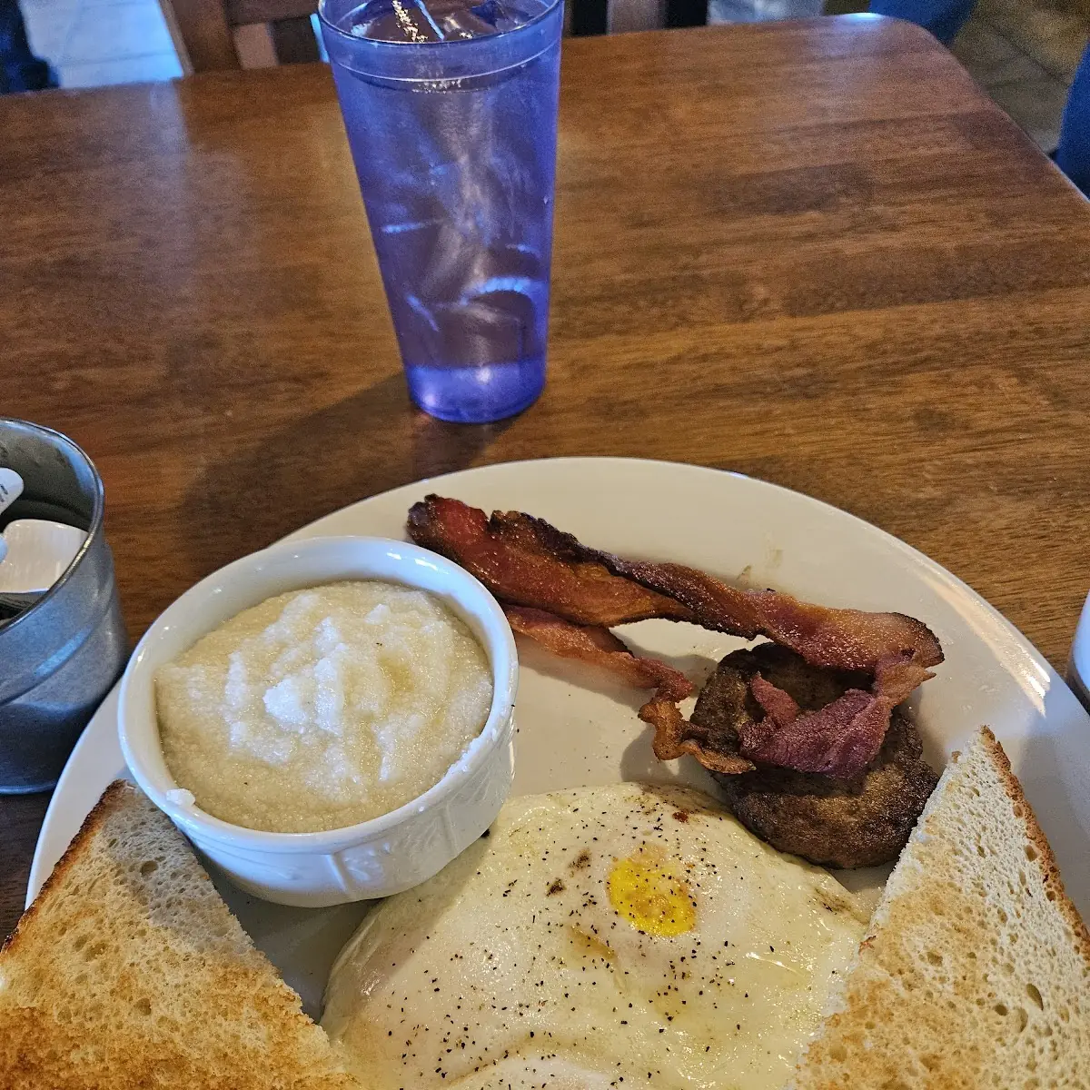 Three Eggs with Bacon Sausage and Grits