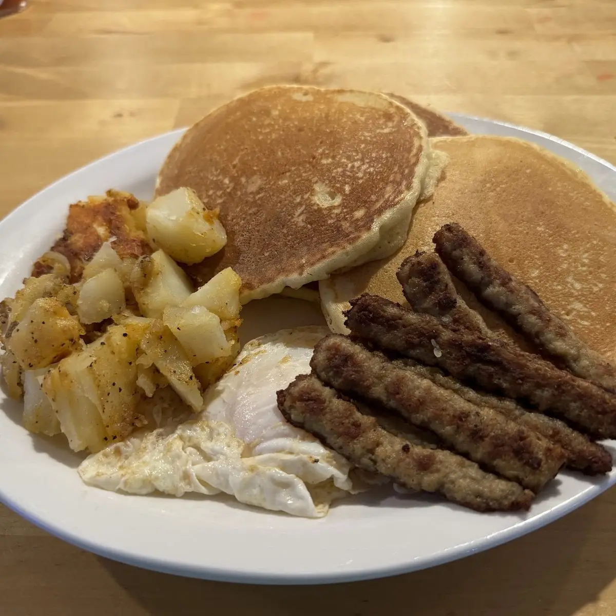 Pancakes Deluxe with Ham Bacon or Sausage & Two Eggs
