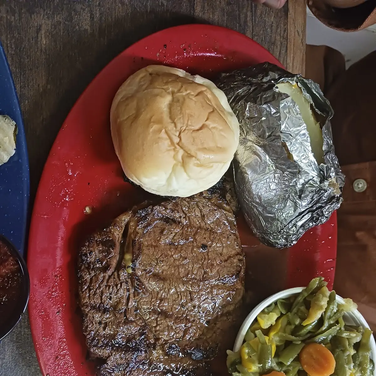 12oz Ribeye with Loaded Baked Potato and Mixed Vegetables