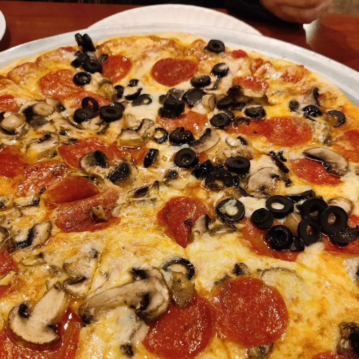 Medium Thin Pizza with Pepperoni Mushrooms and Black Olives