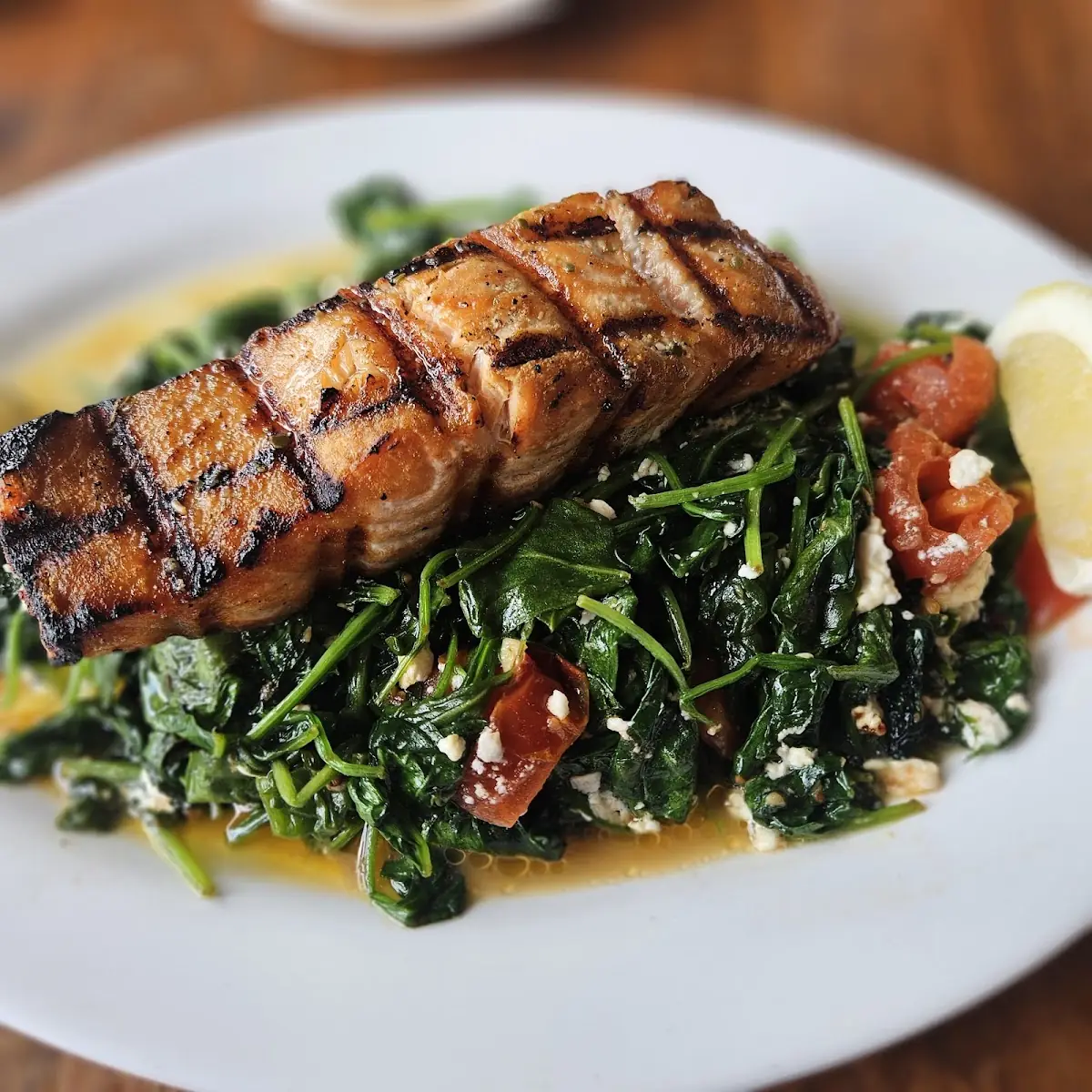 Grilled Salmon over Sautéed Spinach w Feta