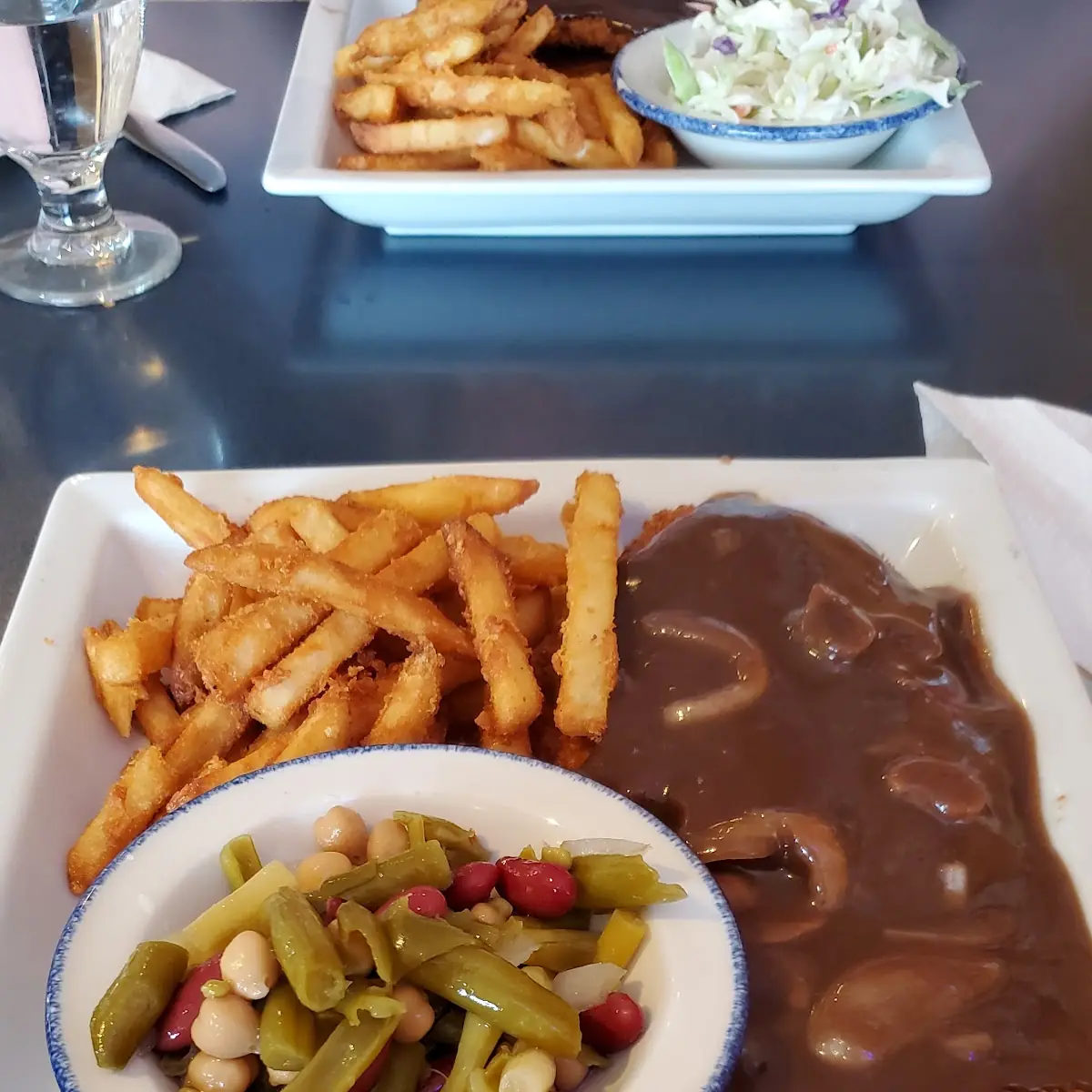 Hunter Schnitzel with Fries and Bean Salad