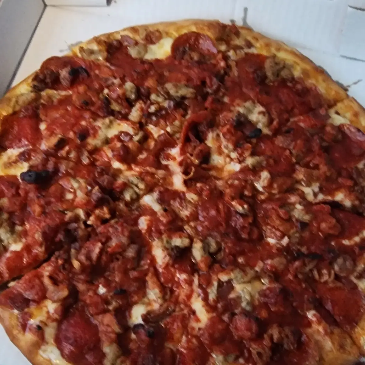 Pepperoni Bacon and Sausage Pizza
