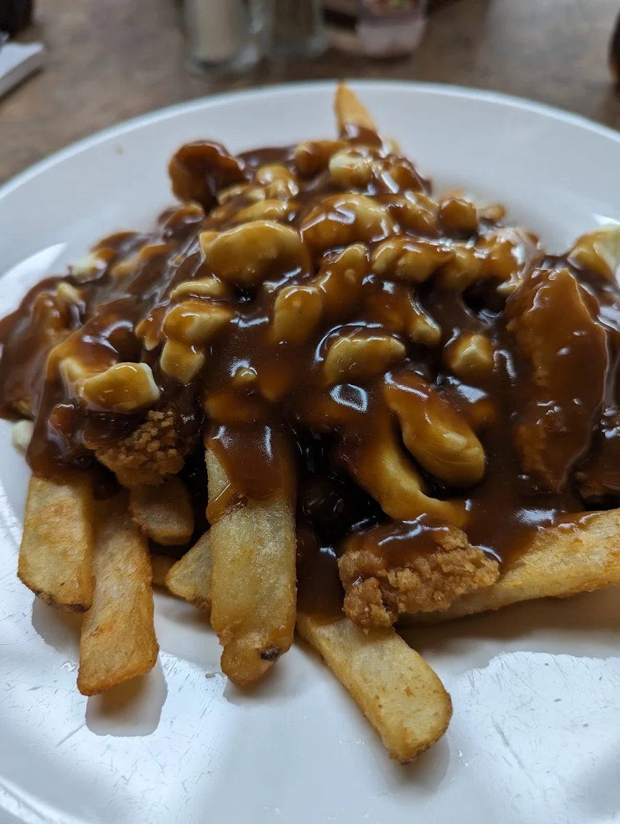 Poutine with Breaded Chicken and Canadian Bacon