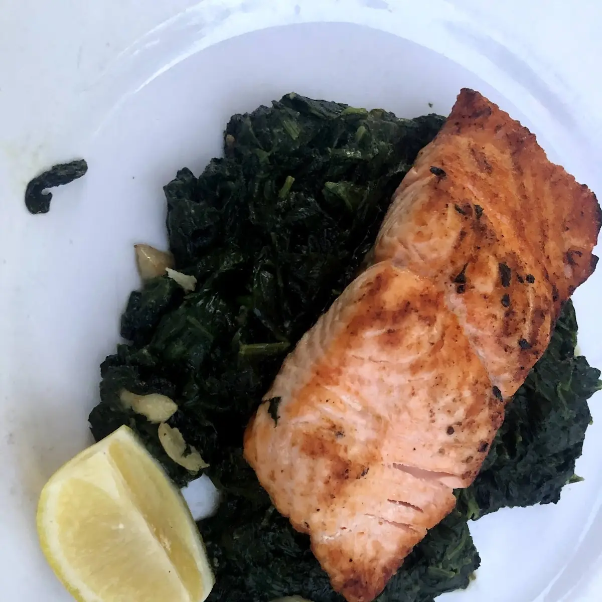 Grilled Salmon over Spinach