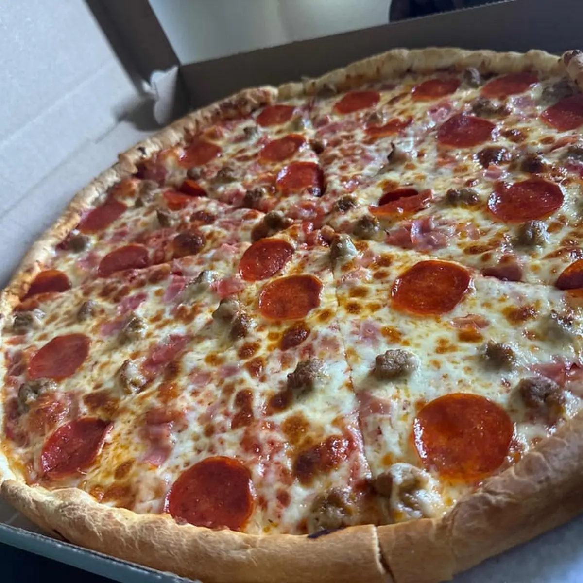 Pepperoni and Sausage Pizza Slice