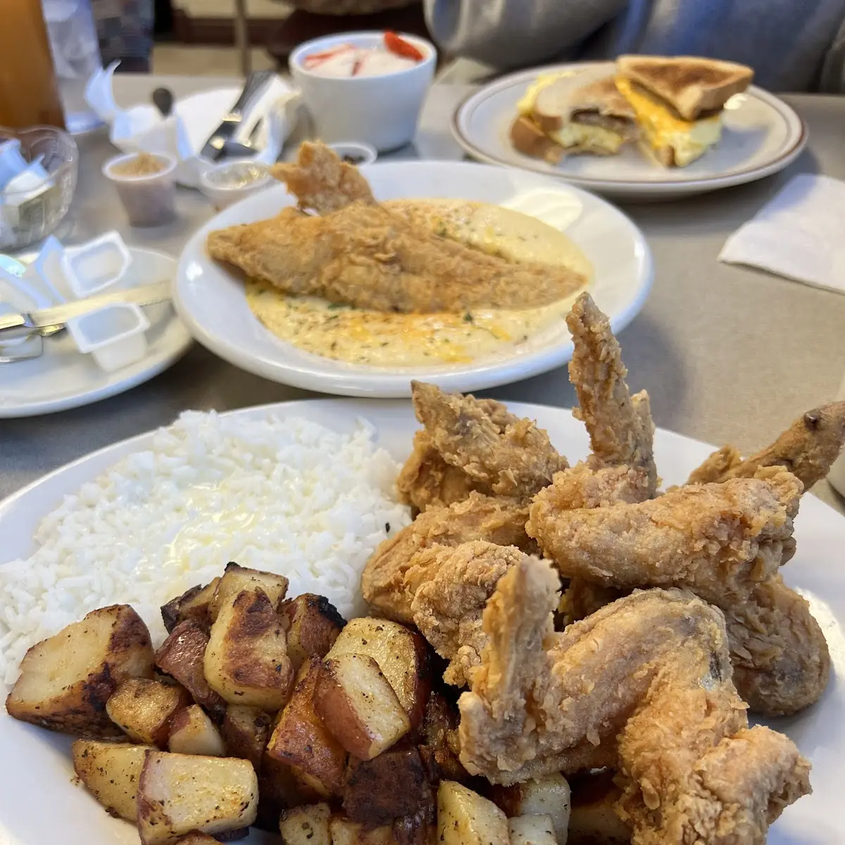Chicken Wings Potatoes and Grits w Pancakes