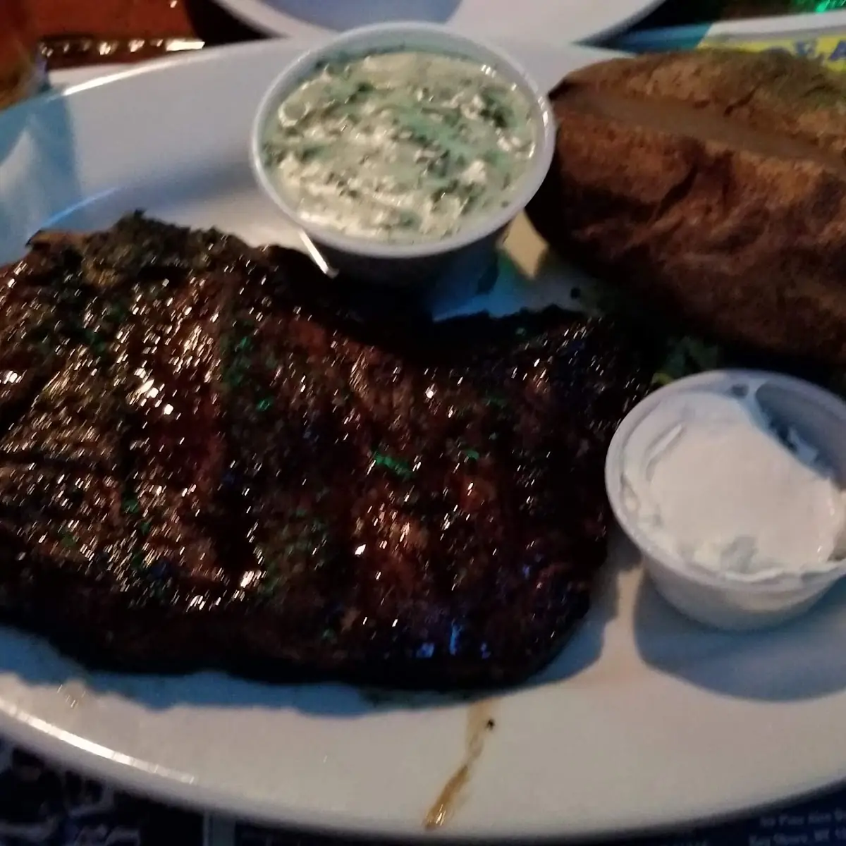 NY Strip Steak Marinated Steak Medium Rare Creamed Spinach and Baked Potato