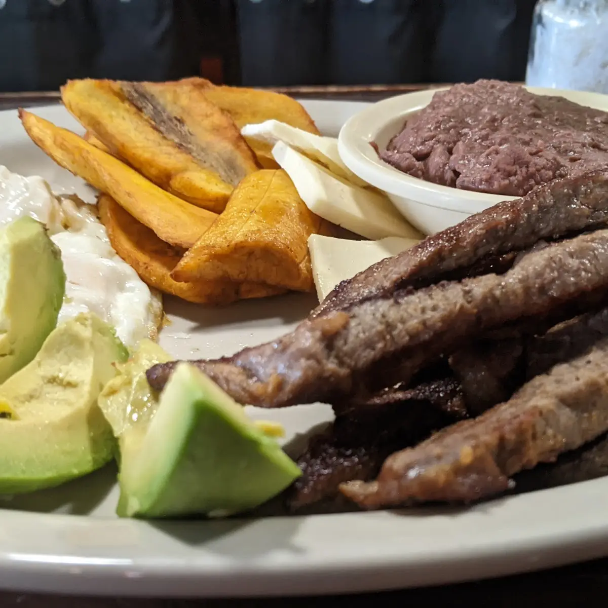 Pan Fried Pork Chop Refried Beans Green Bananas Chips