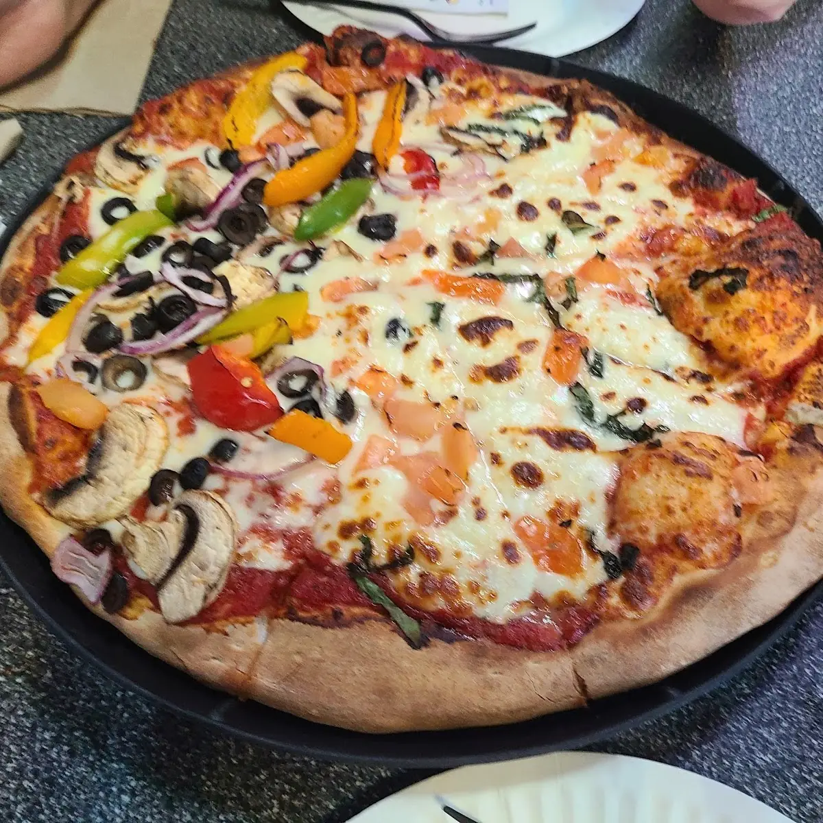 Half Margherita and Half Supreme Pizza