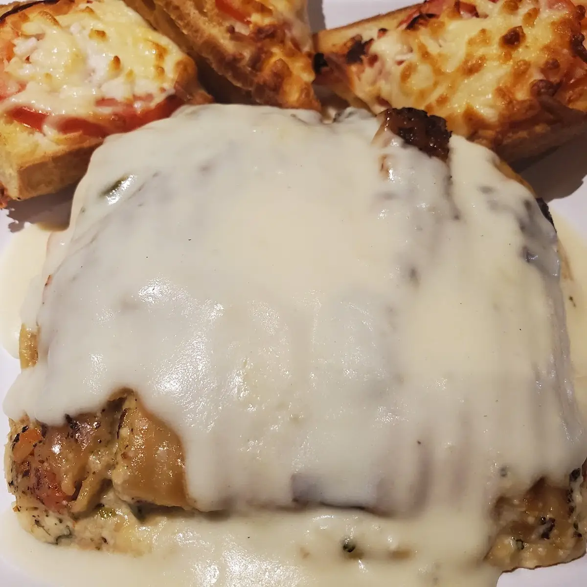 Pork Chop Served with Biscuits and Country Gravy