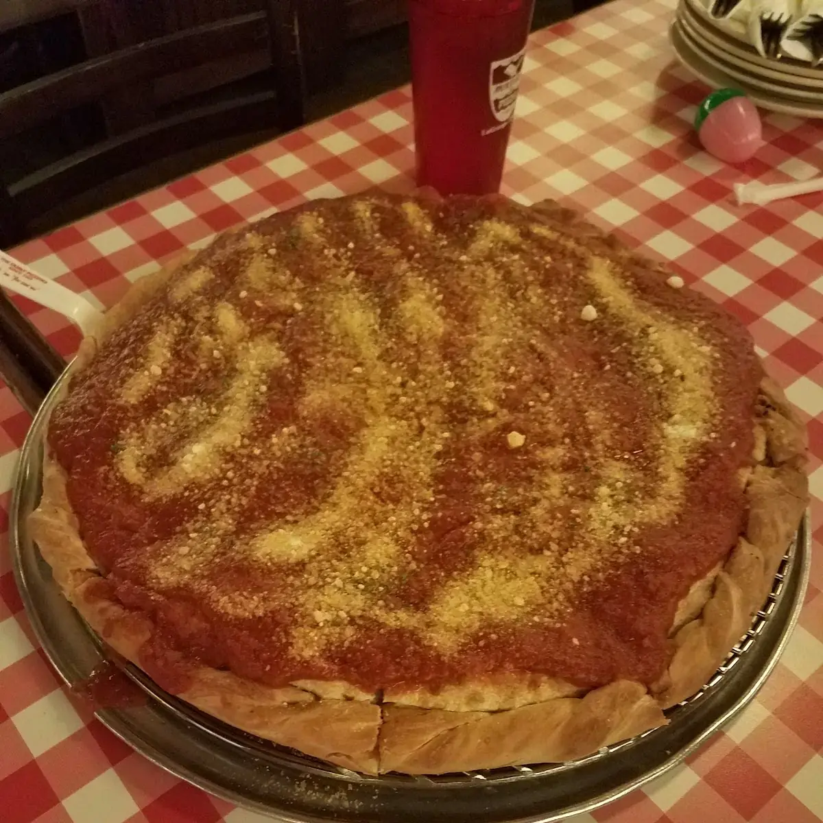 A Stuffed Small Vegetarian Pizza with Extra Marinara Sauce