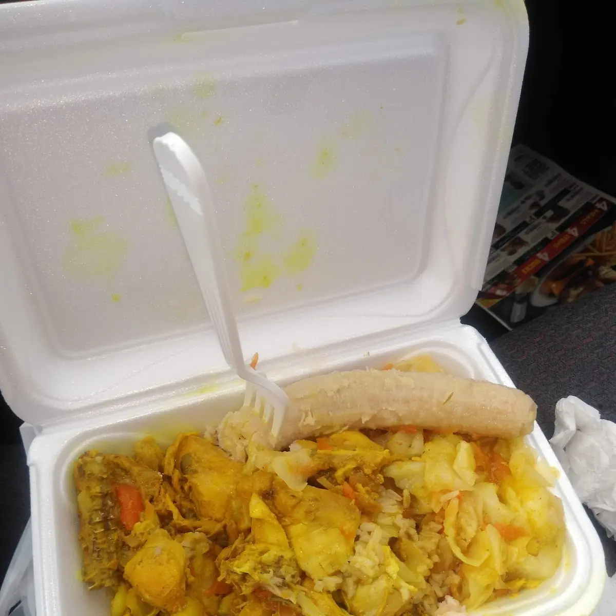 Curry Chicken over White Rice with Cabbage on the Side with a Fresh Cooked Banana
