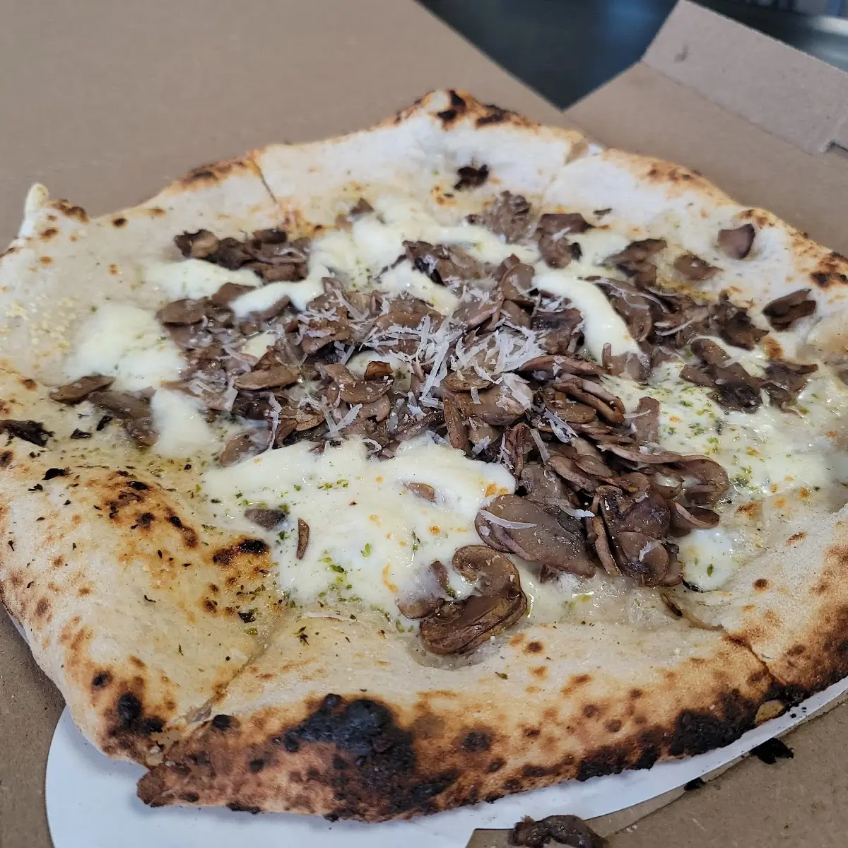 Wood Fired Mushroom Artichoke Pizza Slice