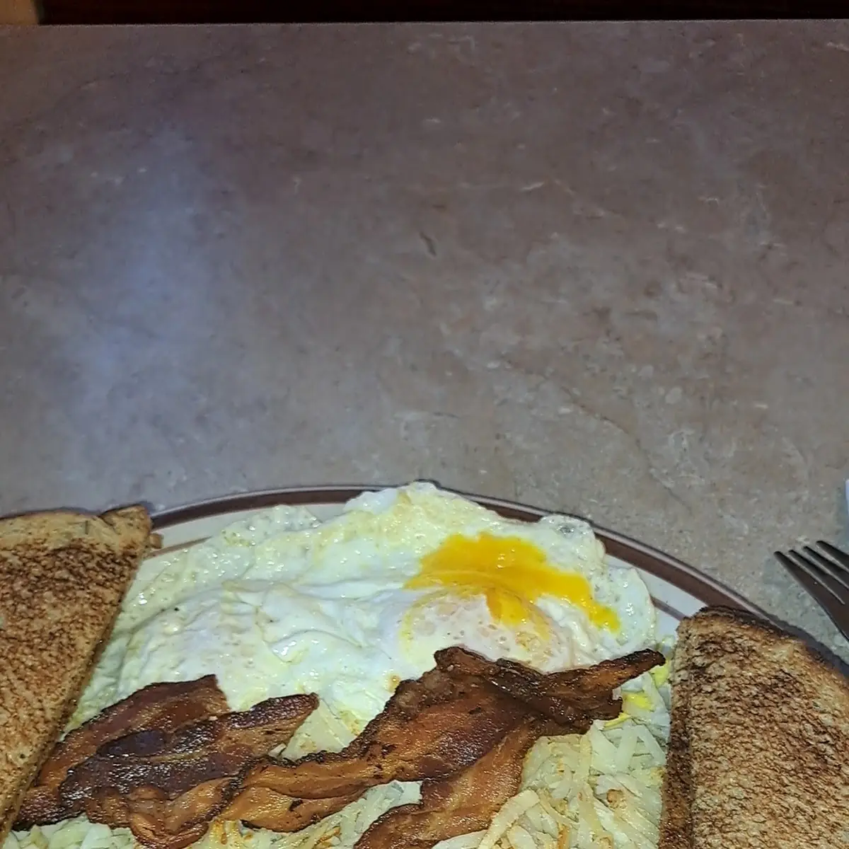 2 Eggs Bacon Hash Browns and Rye Toast