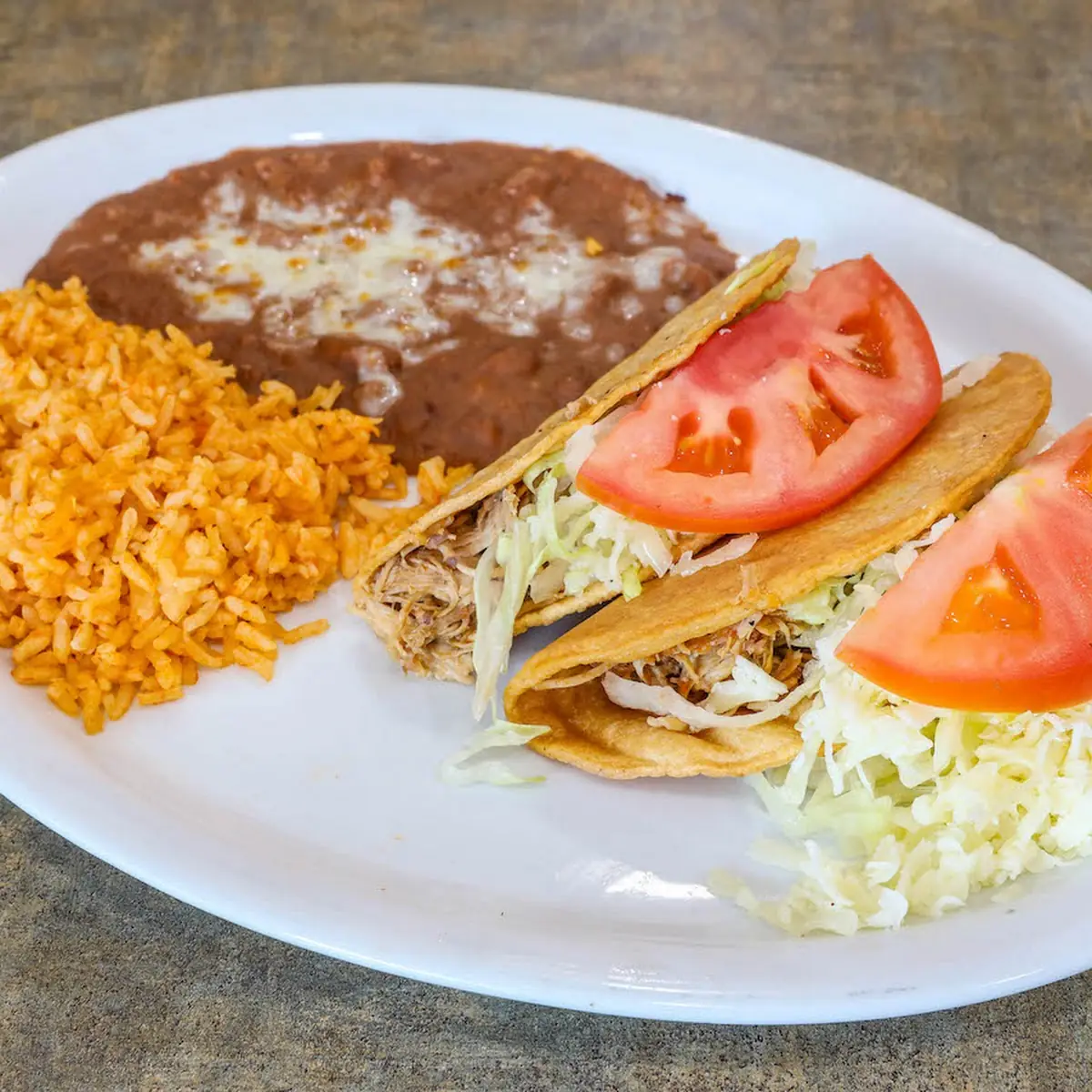 Chicken Enchilada and Shredded Beef Taco Combo