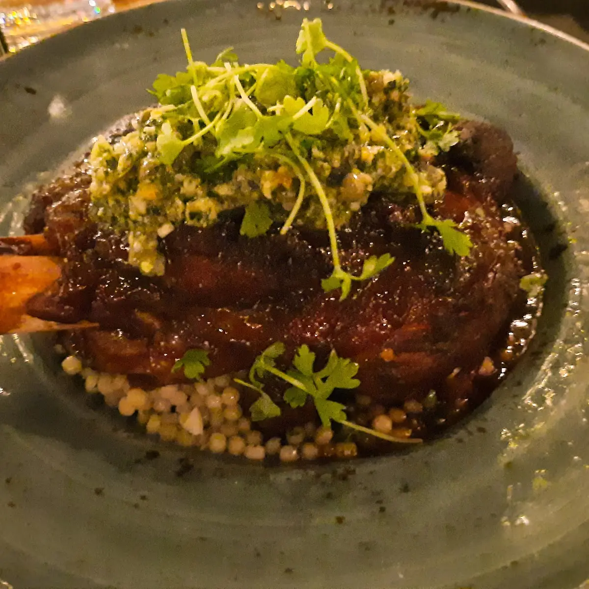 Lamb Shank Harissa Braise Couscous Marinated Olives Mint Gremolata