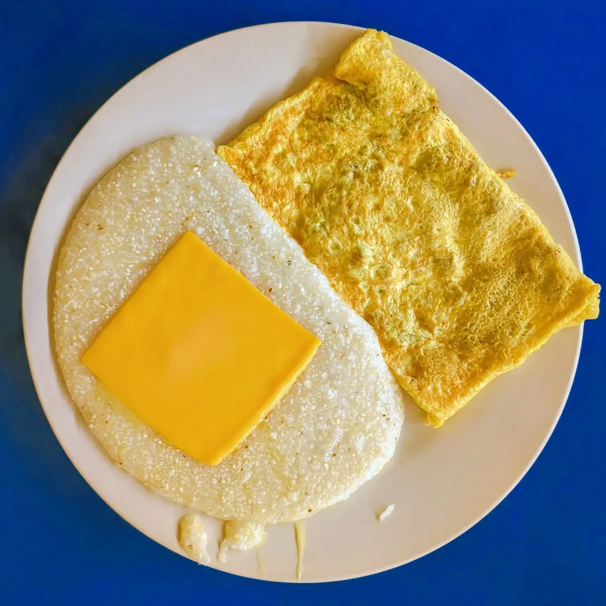 Bacon and Cheese Omelet with Cheese Grits