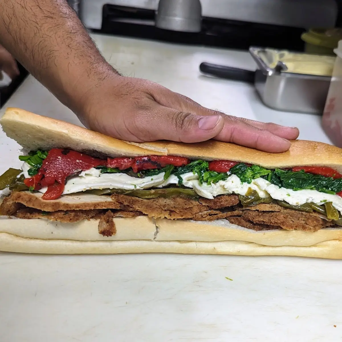 Chicken Mozzarella Roasted Peppers Broccoli Rabe and Long Hots
