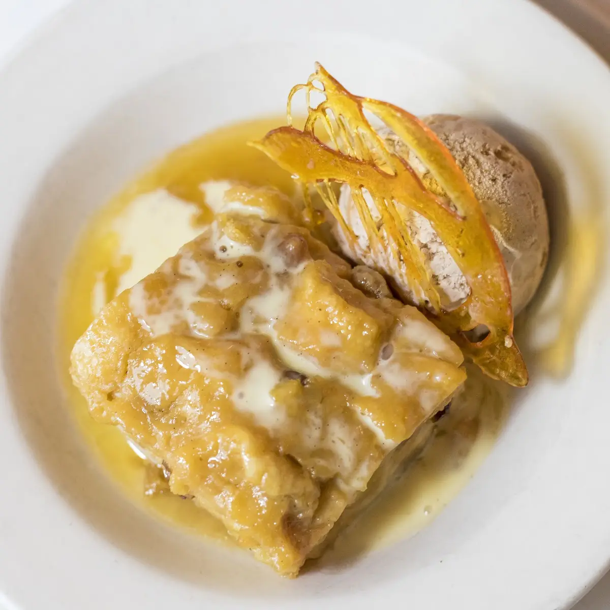 Warm Rum Raisin Apple Bread Pudding