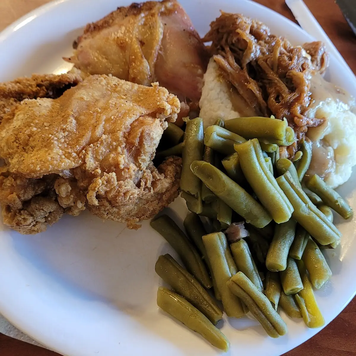 Mashed Potatoes with Gravy and BBQ Pulled Pork and Fried Chicken and Green Beans