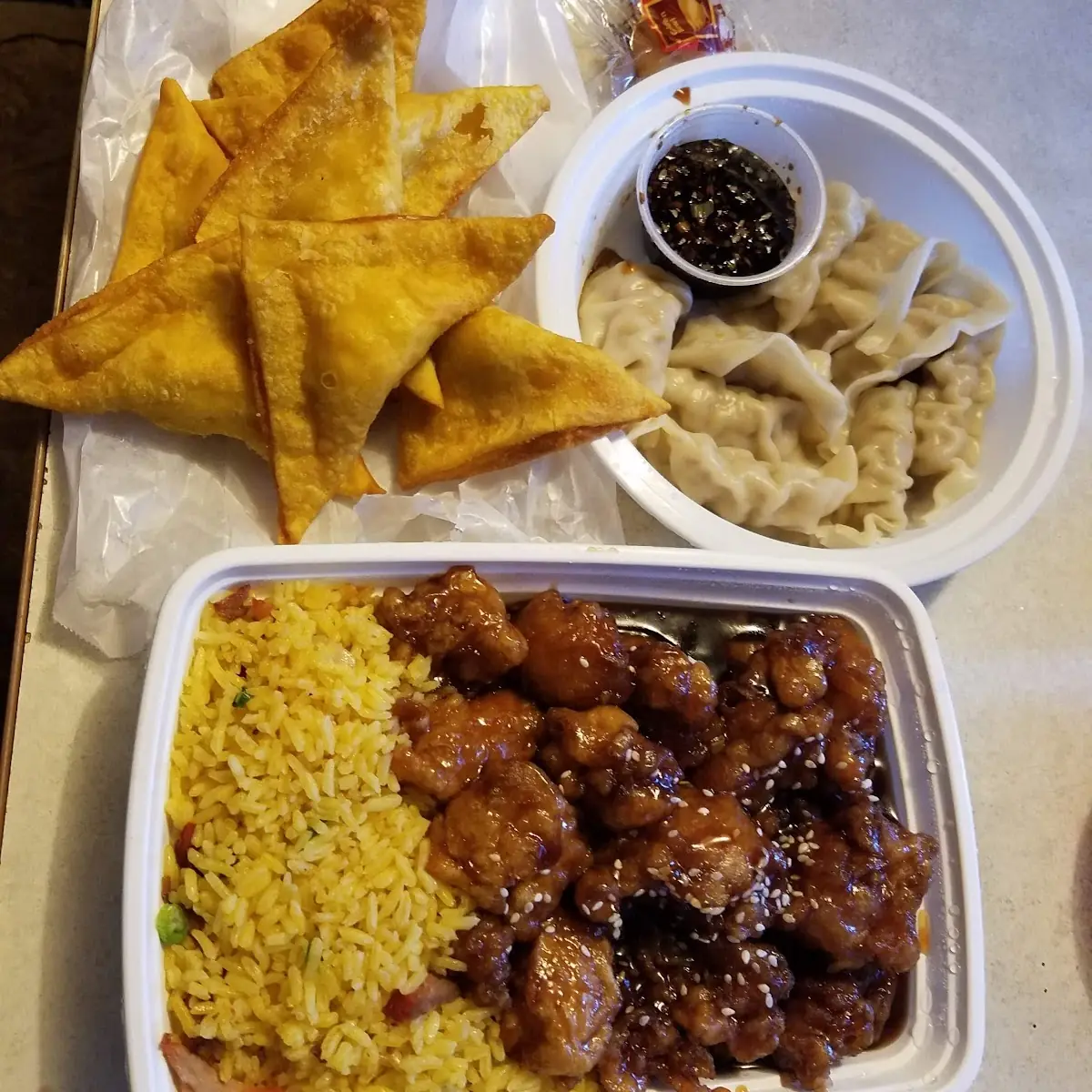 Sesame Chicken Crab Rangoon and Steamed Dumplings