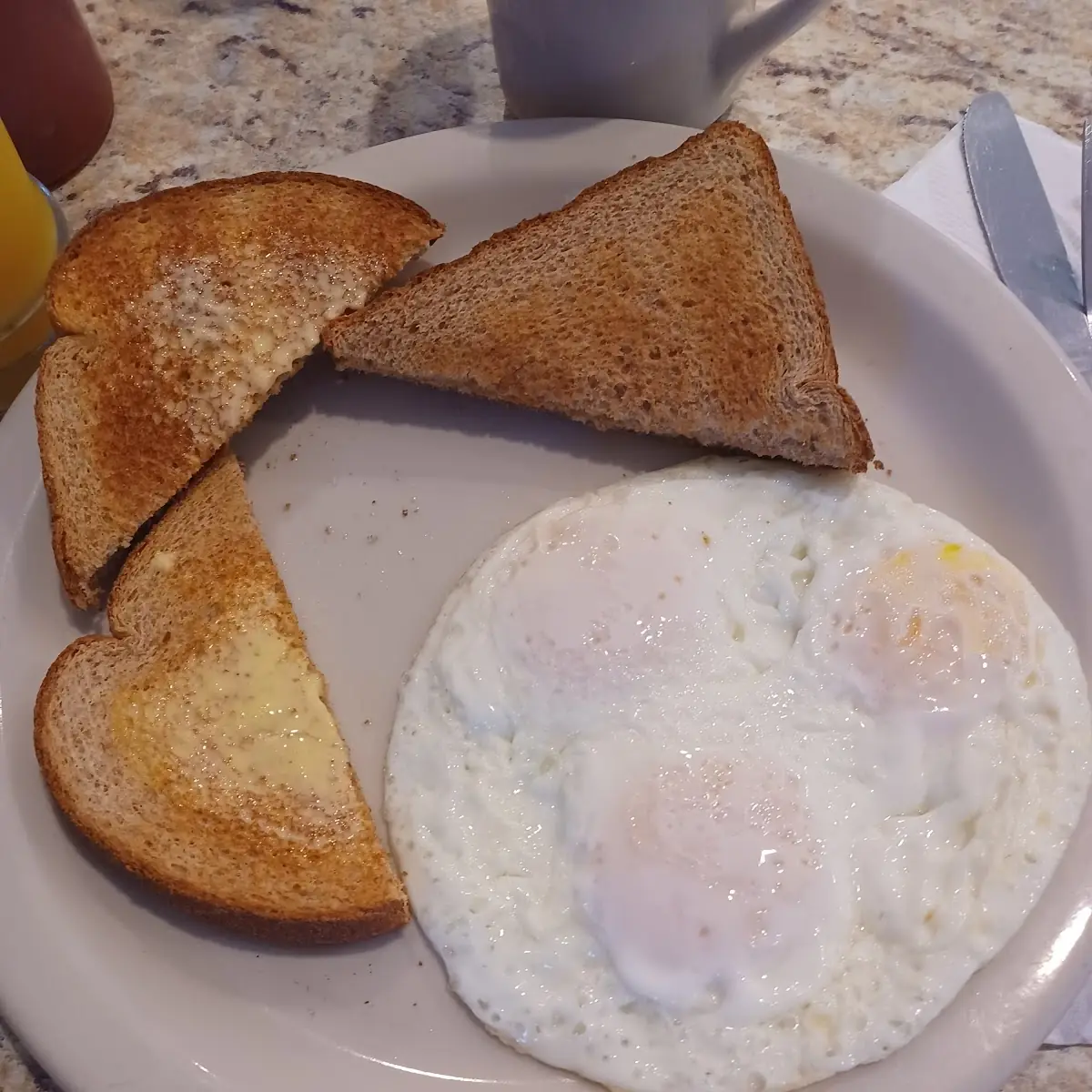 Eggs over Medium and Wheat Toast