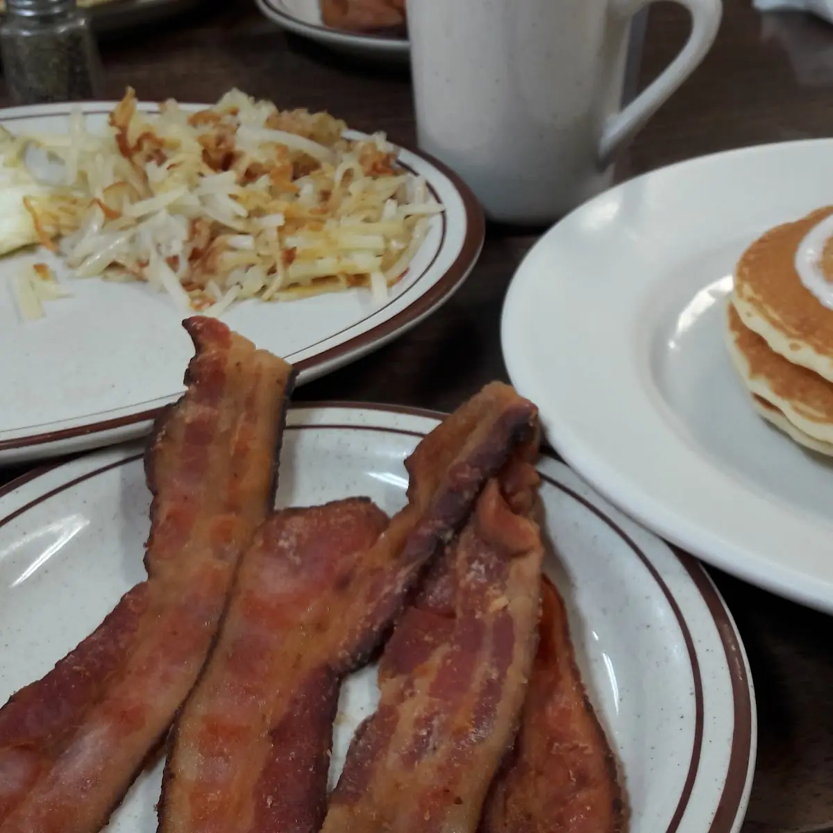Eggs Hash Browns Bacon and Pancakes