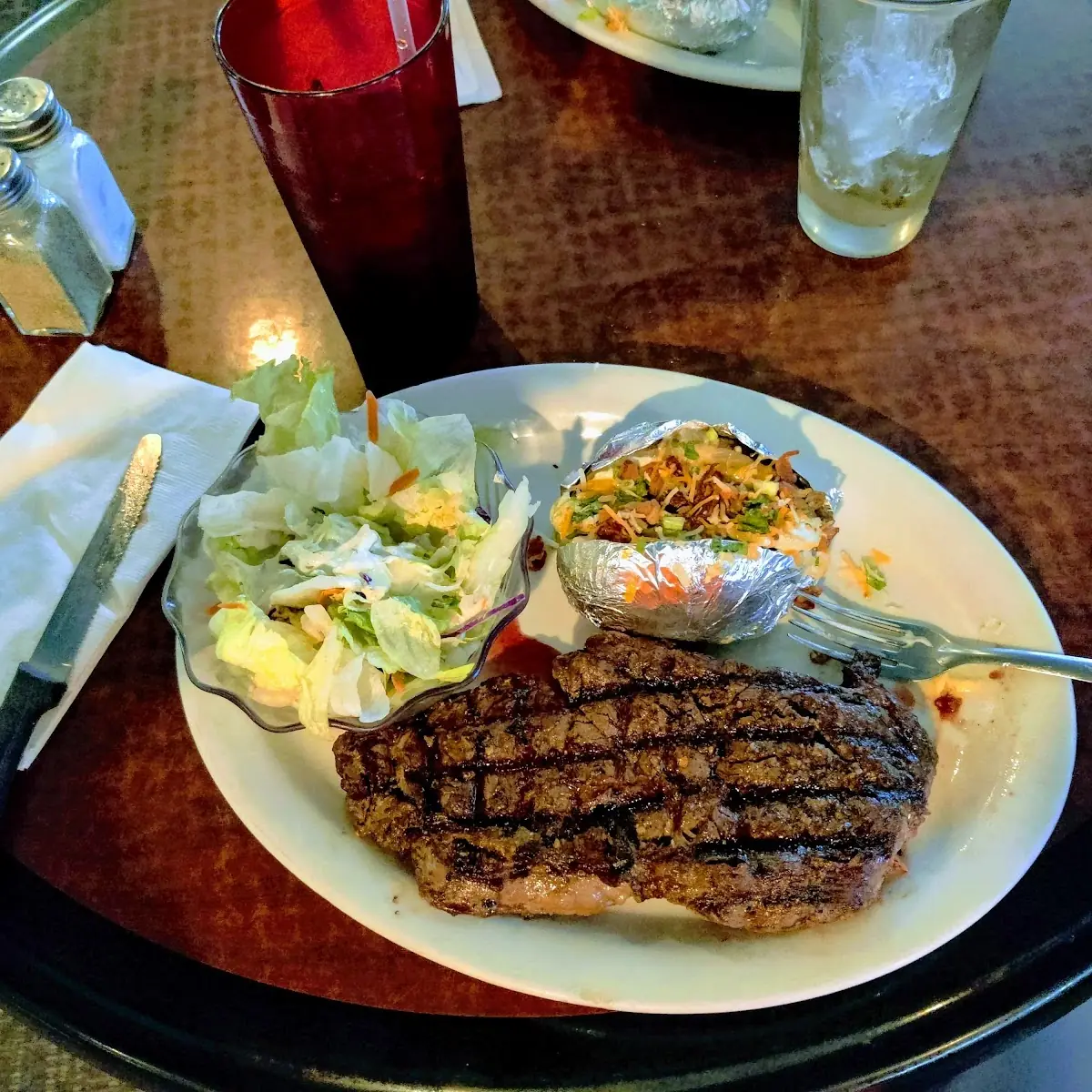 Baked Potato and Ribeye Steak Dinner
