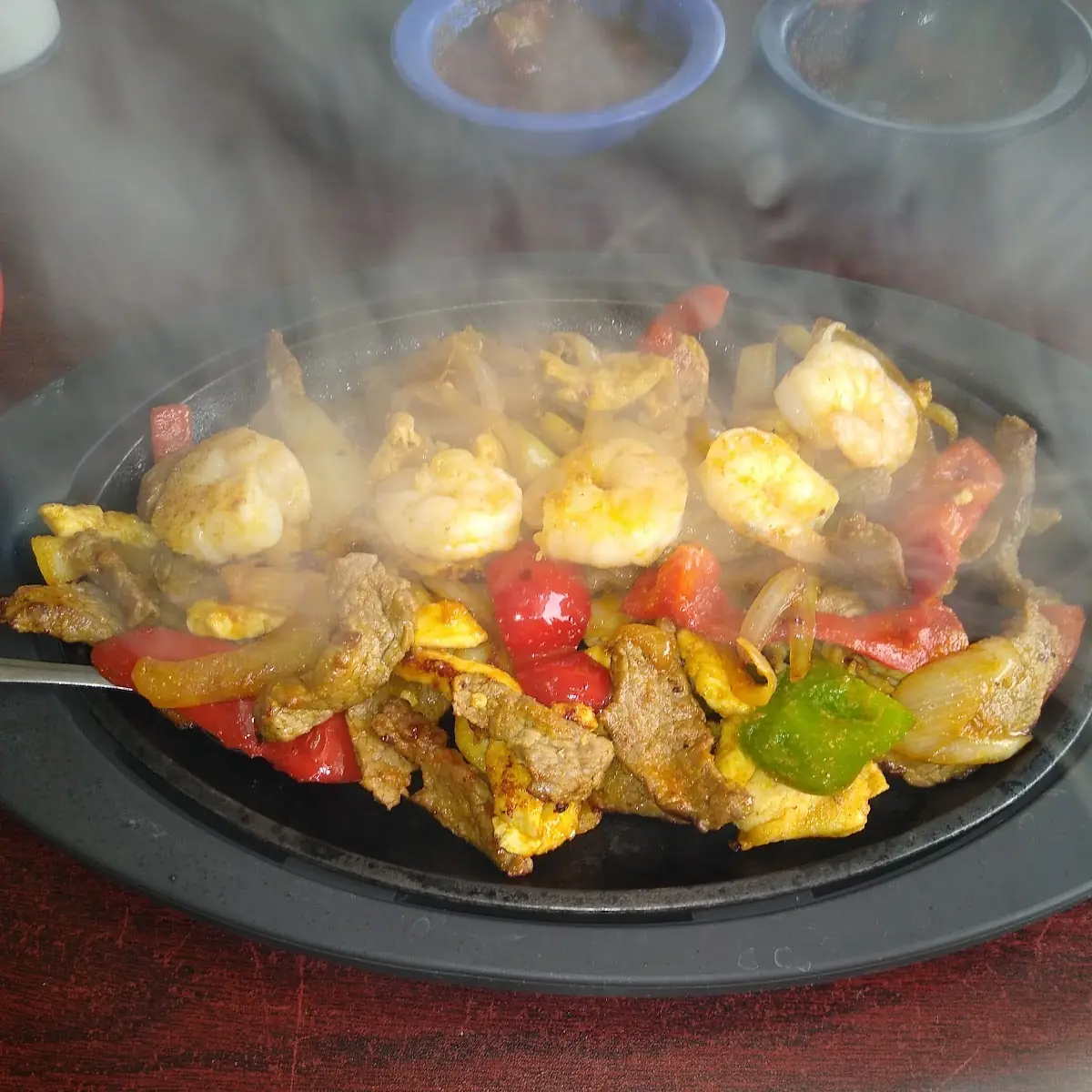 Steak Chicken and Shrimp Fajitas