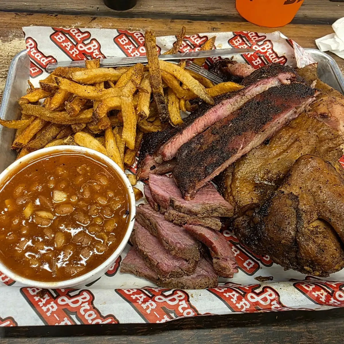Brisket Ribs Pulled Pork Sausage Beans Okra