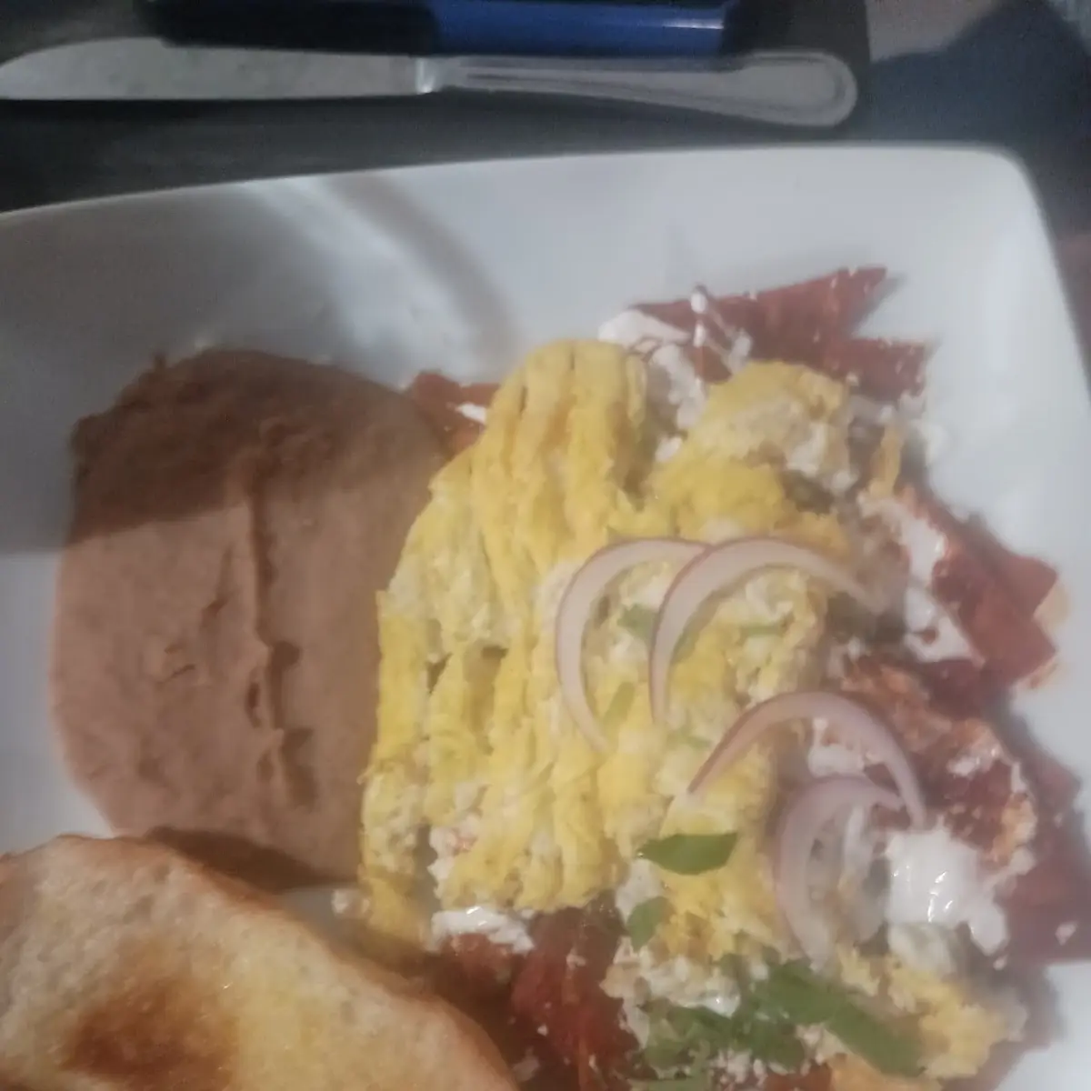 Scrambled Eggs on Chilaquiles Roja