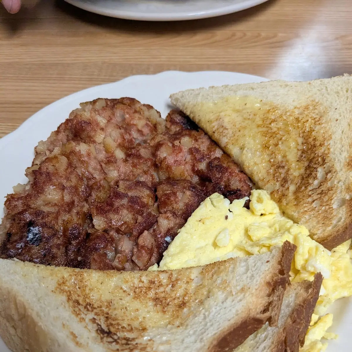 Corned Beef Hash with Scrambled Eggs and Sourdough Toast
