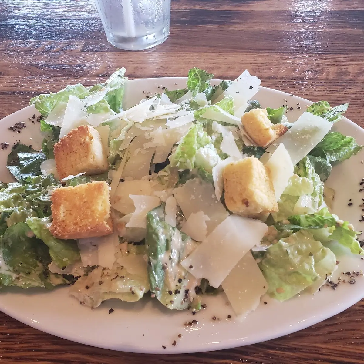 Truffle Caesar Salad with Our Cornbread Croutons and Parmesan Cheese Tossed in Häus Truffle Caesar