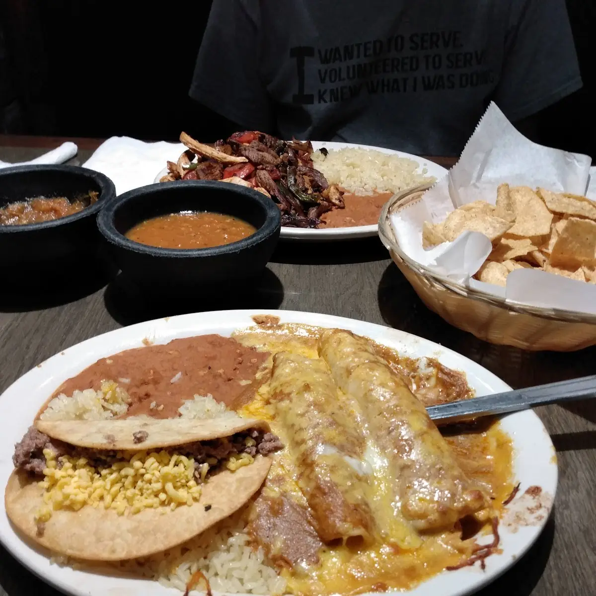 Enchilada Plate with Red Sauce White Rice and Beans on Side