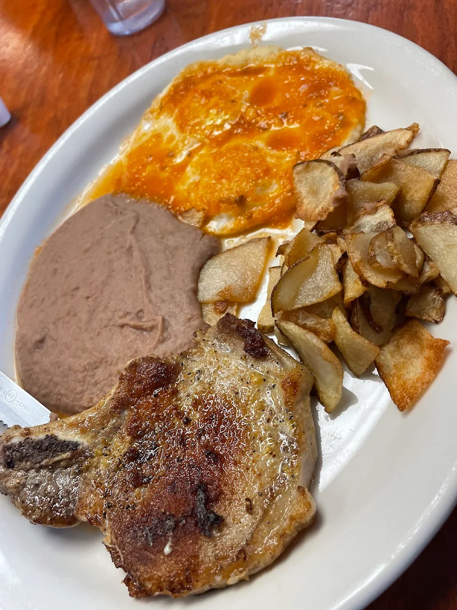 Pork Chop Plate with Eggs over Easy